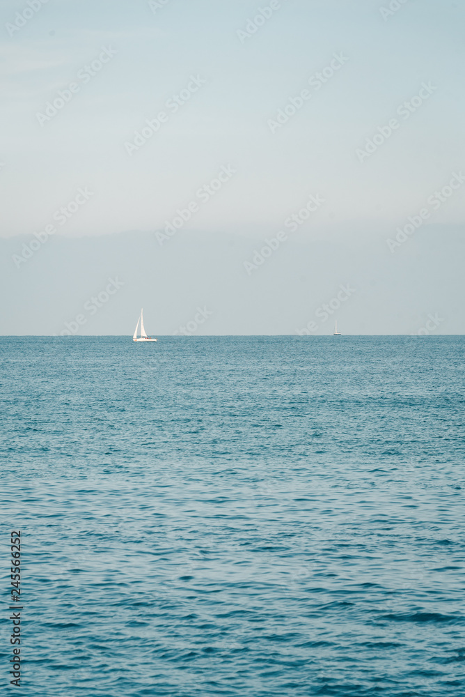 Sailboat in the Mediterranean, from La Barceloneta, in Barcelona, Spain