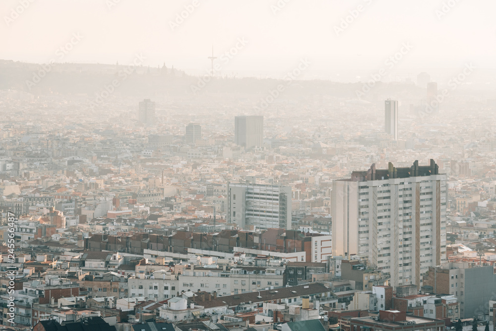 Hazy cityscape view from Bunkers del Carmel, in Barcelona, Spain