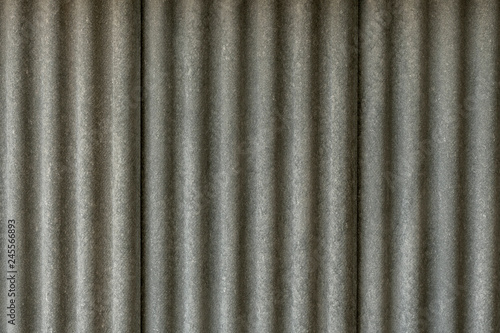 Texture of fiber cement roof sheet. Close up of corrugated wave asbestos tile. Classic style.
