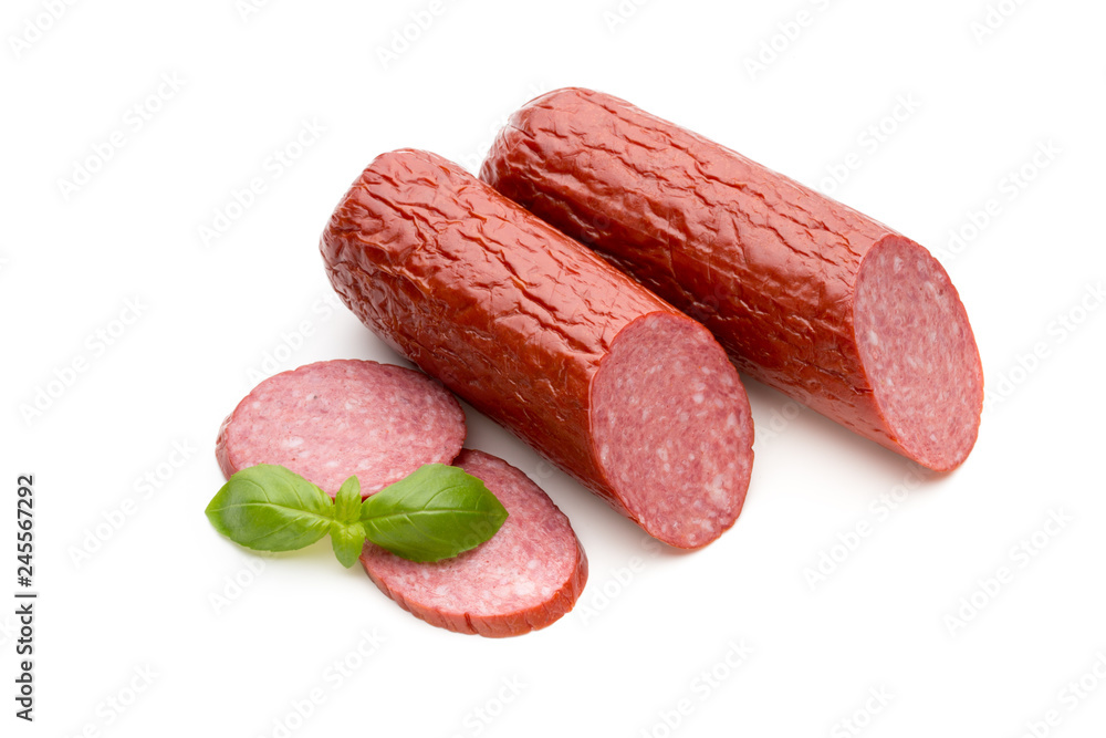 Salami smoked sausage, basil leaves on white background cutout. Salami smoked sausage, basil leaves on white background cutout.