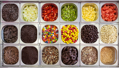Containers with ice cream toppings photo