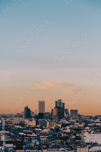 View of modern buildings at sunset in Madrid, Spain © jonbilous