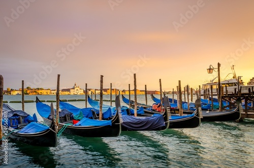 Gondolas moored, Venice, Italy. Gondolas boats parking in grand