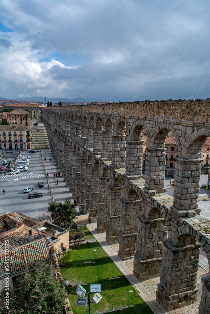 Medieval aqueduct in on the city square of Segovia in Spain
