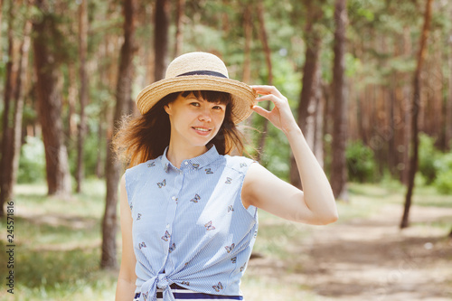 Beautiful woman in straw boater hat smile in summer