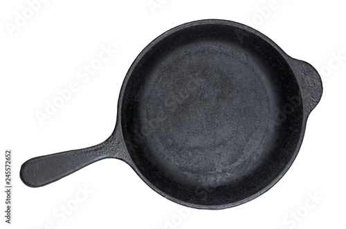 Old cast iron pan isolated on white background, top view