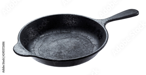Old cast iron pan isolated on white background