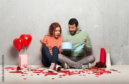 Couple in valentine day holding gift box in hands