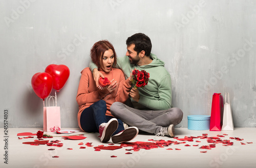 Couple in valentine day with flowers and gifts