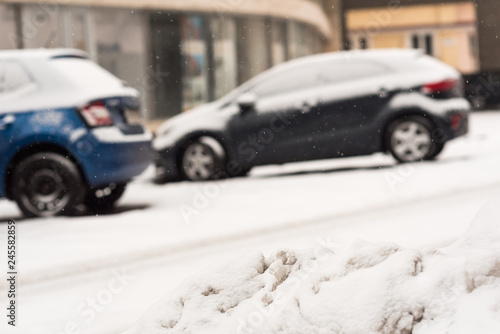 Fototapeta Naklejka Na Ścianę i Meble -  Car on winter road covered with snow. Vehicle at snowfall