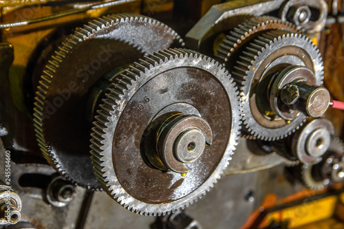 Gear metal wheels in industrial machine close-up
