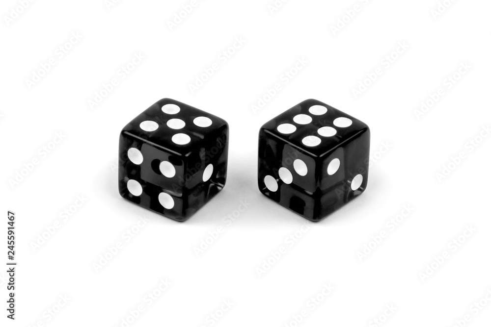 Two black glass dice isolated on white background. Five and six.