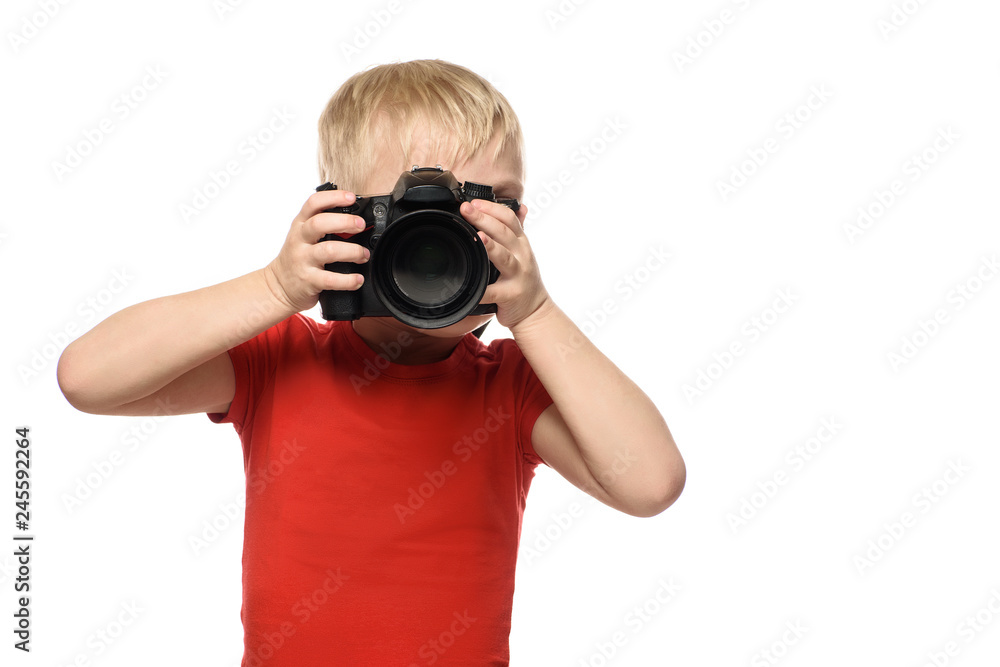 Young blond boy with camera. Portrait, isolated on white background. Young blond boy with camera. Portrait, isolated on white background.