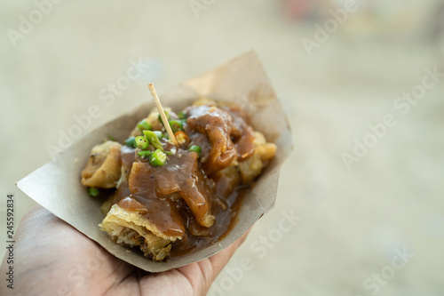 hand holding a simple lumpiang dish photo