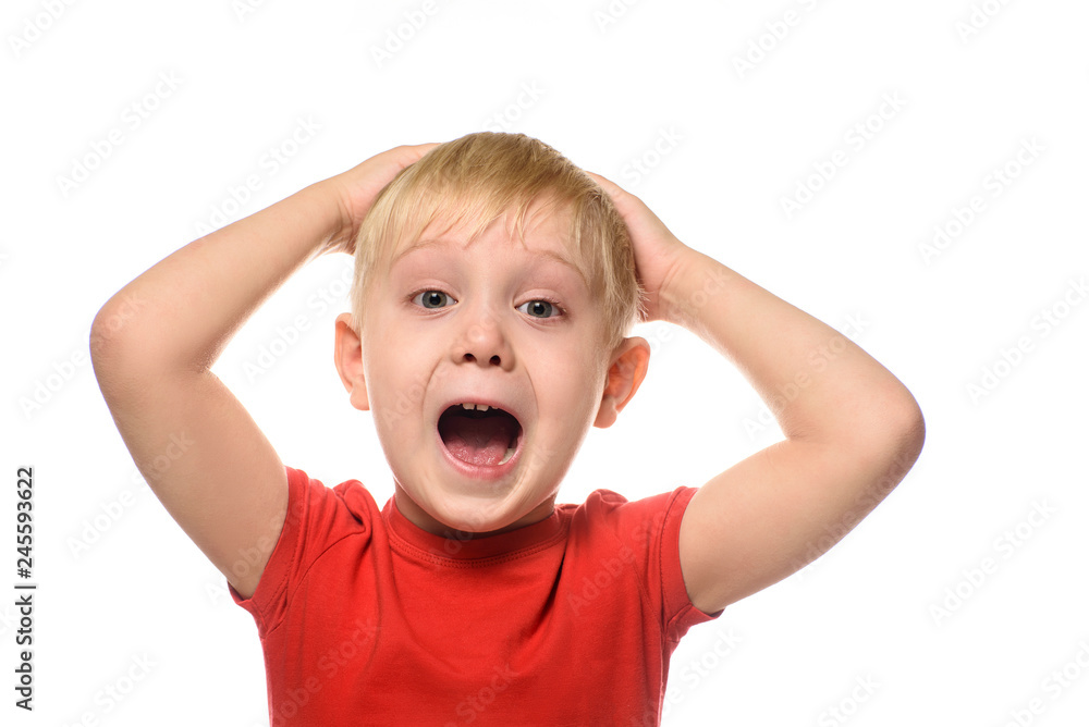 Screaming blond boy in a red t-shirt folded his arms behind his head. Isolate on white background. Screaming blond boy in a red t-shirt folded his arms behind his head. Isolate on white background.