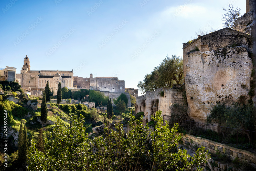Gravina in Puglia: picturesque landscape of the the deep ravine and the old town with the ancient cathedral, Bari, Apulia, Italy