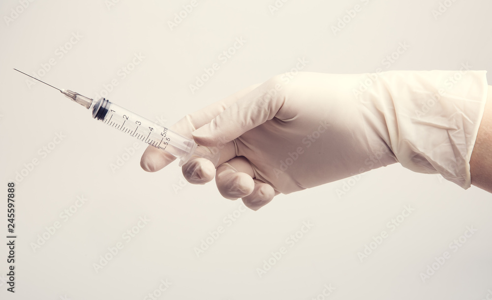 Health nurse worker with vaccine syringe. Concept vacine for healty lifestyle. Toned Image. Health nurse worker with vaccine syringe. Concept vacine for healty lifestyle. Toned Image.