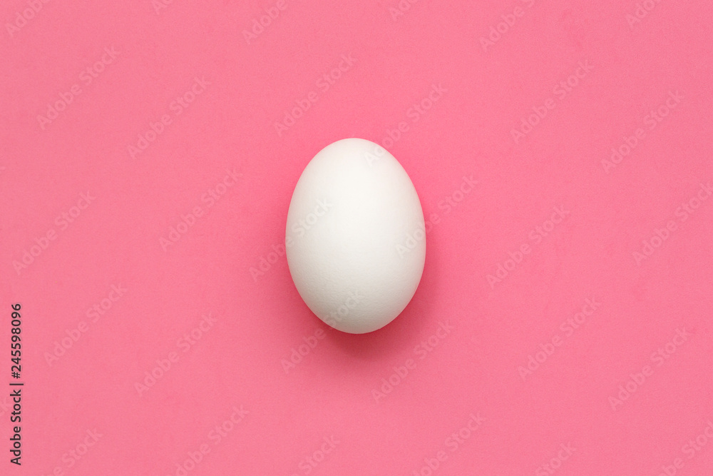 White Easter egg on pastel background. Happy Easter concept. Minimal concept. Flat lay. Top view. White Easter egg on pastel background. Happy Easter concept. Minimal concept. Flat lay. Top view.