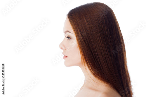Skin and hair care. Portrait of a young beautiful woman with clean and healthy skin.