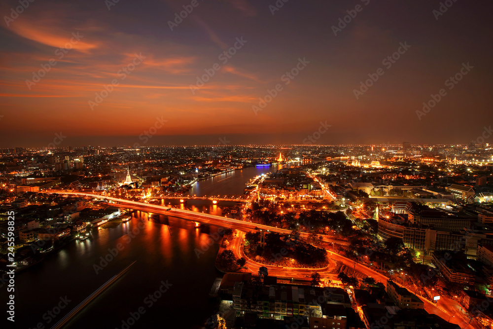 Fototapeta premium City Scape, Panorama of Chao Praya River. River view overlooking the Phra Phuttha Yodfa Bridge or Memorial Bridge and Wat Arun with grand Palace in the background, Bangkok Thailand. 26 January 2019