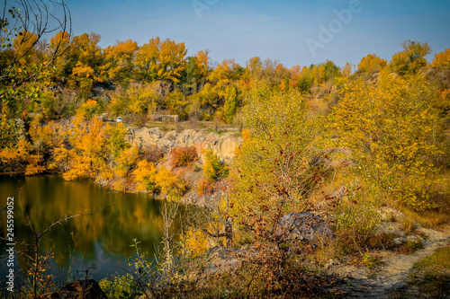 Old flooded quarry in autumn