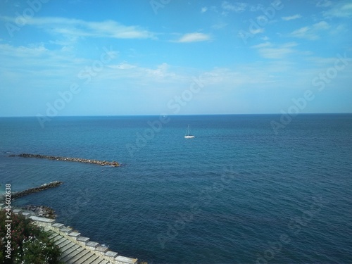 Blue sea and sky and coast with green