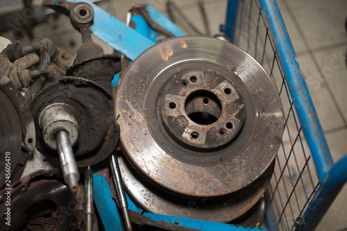 Worn out rusty brake discs and other parts - Image