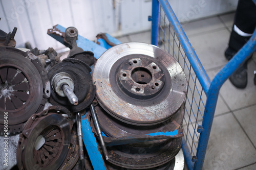Worn out rusty brake discs and other parts - Image photo