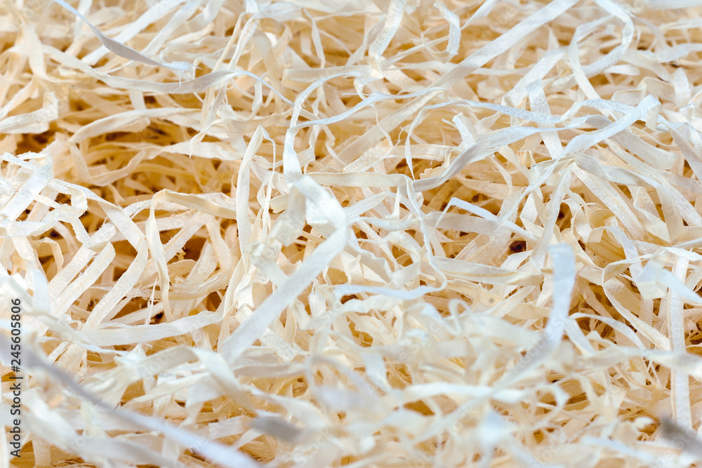 Wood background. Close-up of wooden shavings for packing.