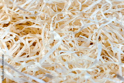 Wood background. Close-up of wooden shavings for packing.