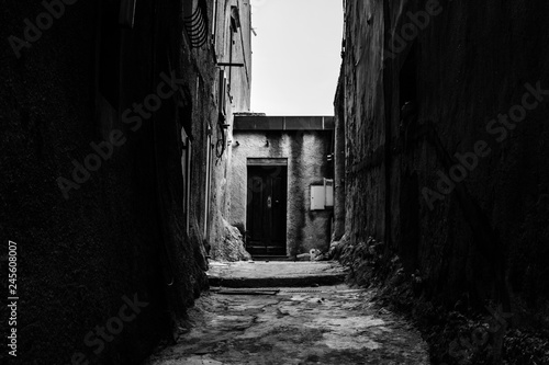 Black and white picturesque, narrow streets of the old city of Bonifacio, Corsica photo