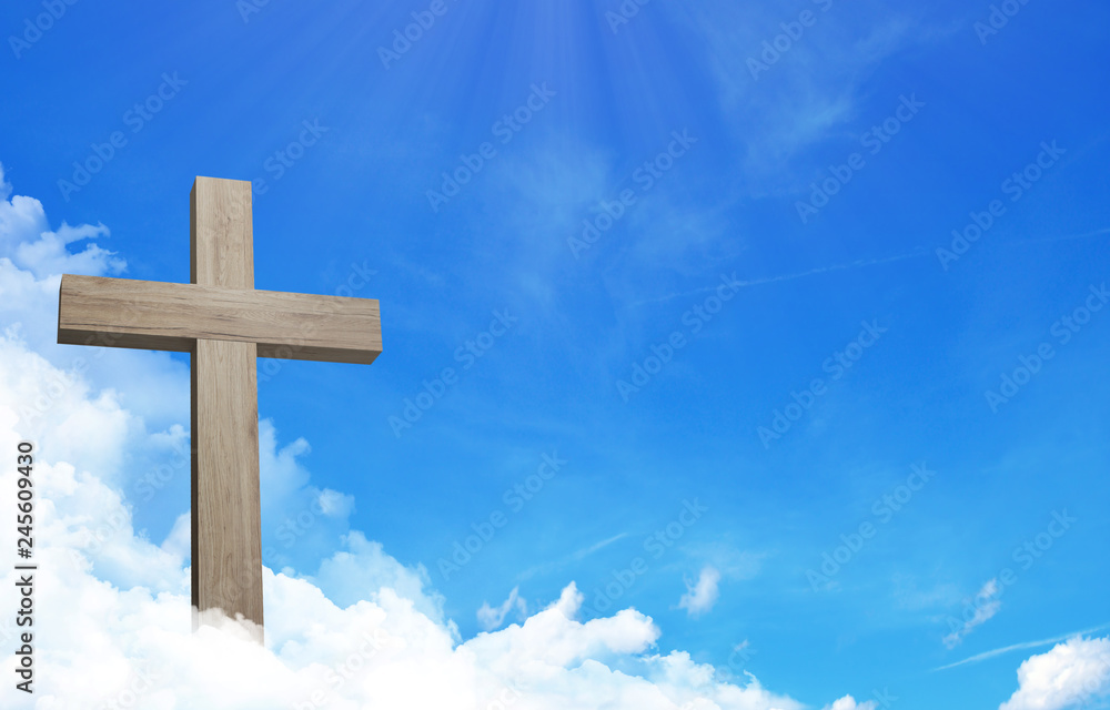 The cross of jesus and cloudful blue sky with copy space
