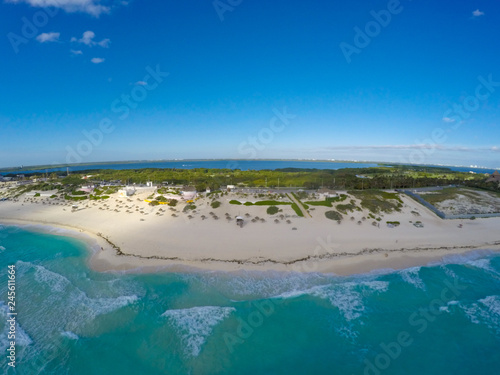 Playa Delfines, Cancun, Mexico. Aerial view on beach and coast of Caribbean sea against blue sky. Top view