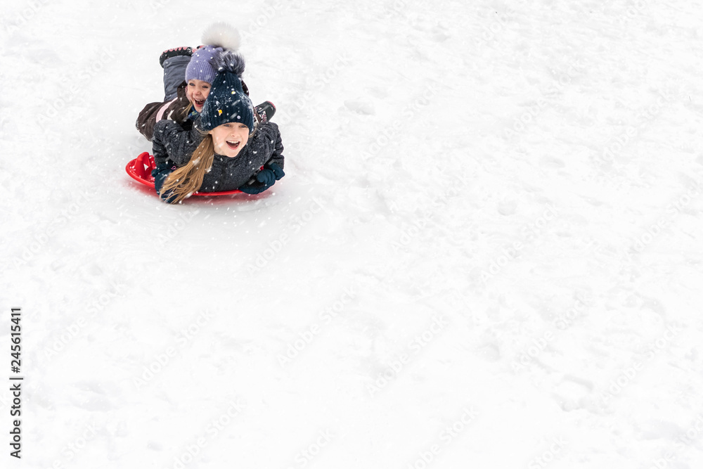 children slide on ice-boats