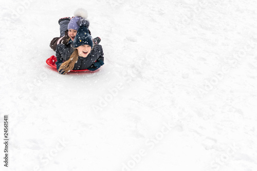children slide on ice-boats