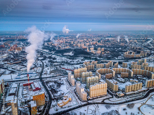 Aerial view of the colorful frosty winter evening and residential areas in Moscow.