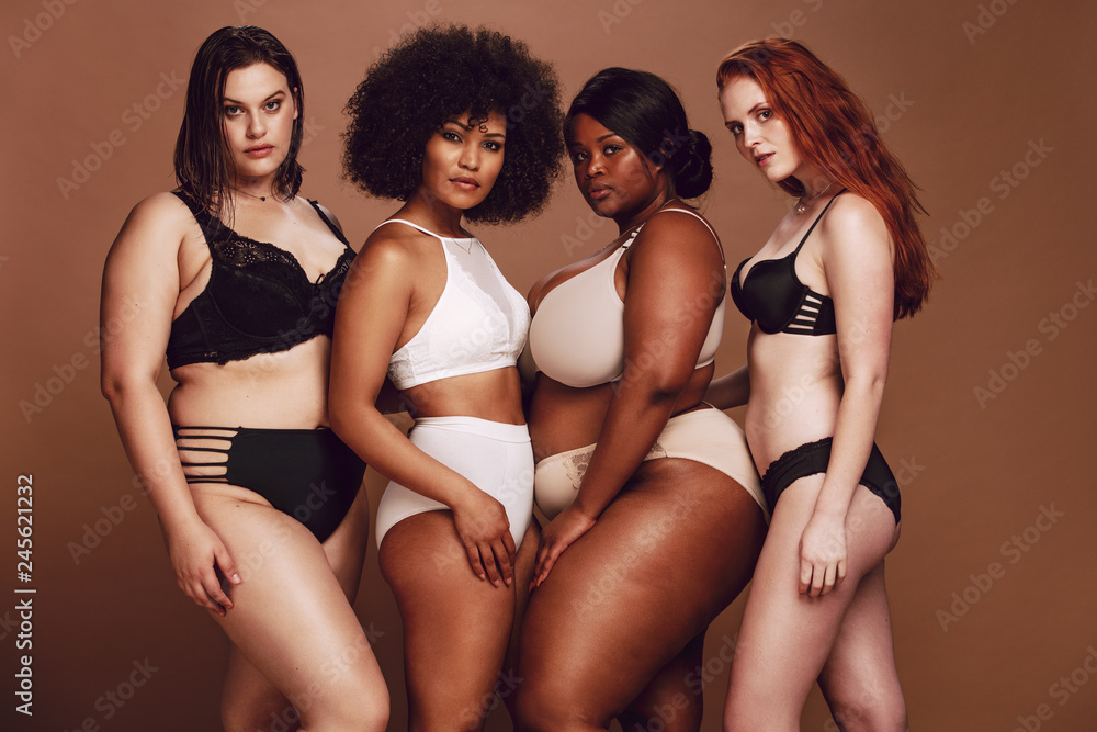Proud group of women in lingerie posing together - obrazy, fototapety, plakaty 
