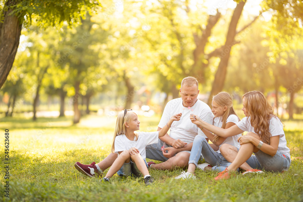 Young family with smiles and children in nature Young family with smiles and children in nature