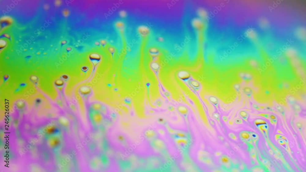 Psychedelic background of motion surface of colorful soap bubble Psychedelic background of motion surface of colorful soap bubble