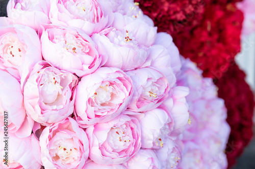 Abstract closeup of red and pink roses and carnations macro showing detail and texture on floral decoration