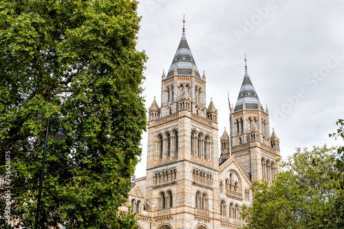 Exterior historic architecture of Natural History Museum in Kensington Chelsea area of London, UK during cloudy summer autumn day looking up and nobody