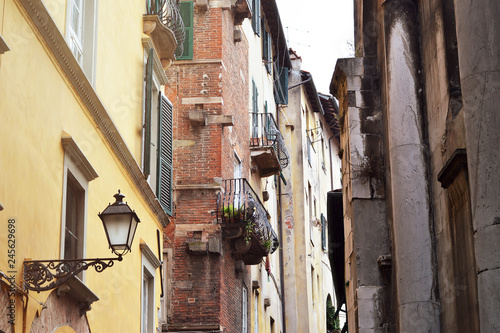 Narrow street in Lucca, Italy © izzzy71
