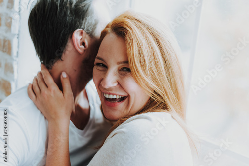 Love and fun between happy adult couple