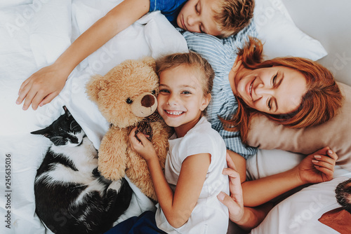 Close up family enjoying together after waking up photo