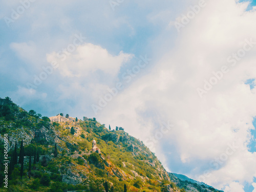 Montenegro, Herceg Novi. Tiled roofs of old town at background of the Adriatic Sea, mountains, cruise liner.