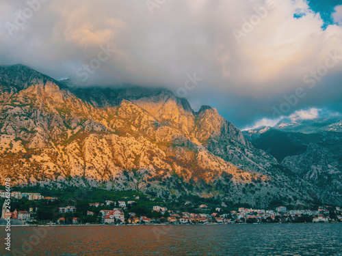 Montenegro, Herceg Novi. Tiled roofs of old town at background of the Adriatic Sea, mountains, cruise liner.