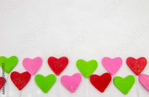 Valentines day decorative background with decorative colorful hearts on a white background. Close up. Top view.