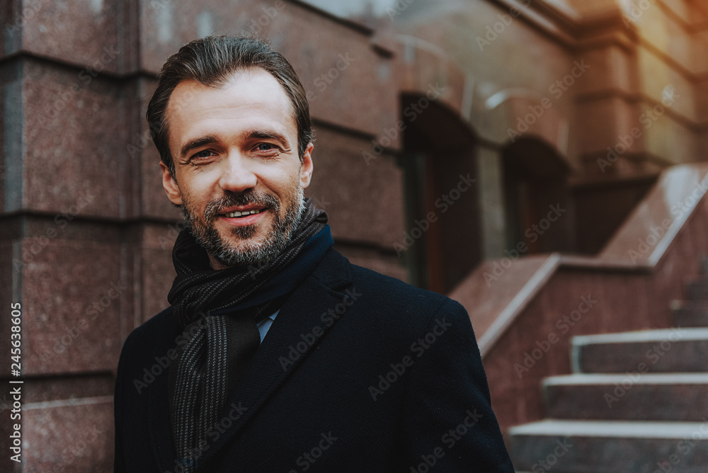 Relaxed man is walking down stairs outside Relaxed man is walking down stairs outside