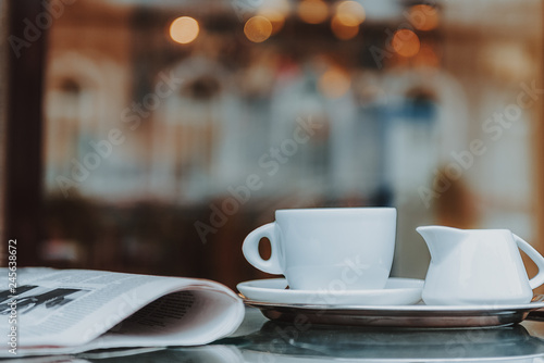 Tasty coffee and paper are prepared for visitor