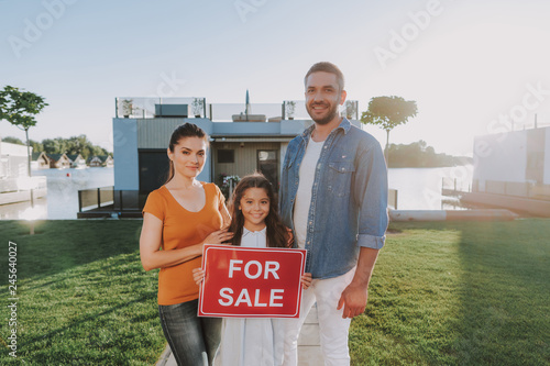 Cheerful friendly full family selling their house
